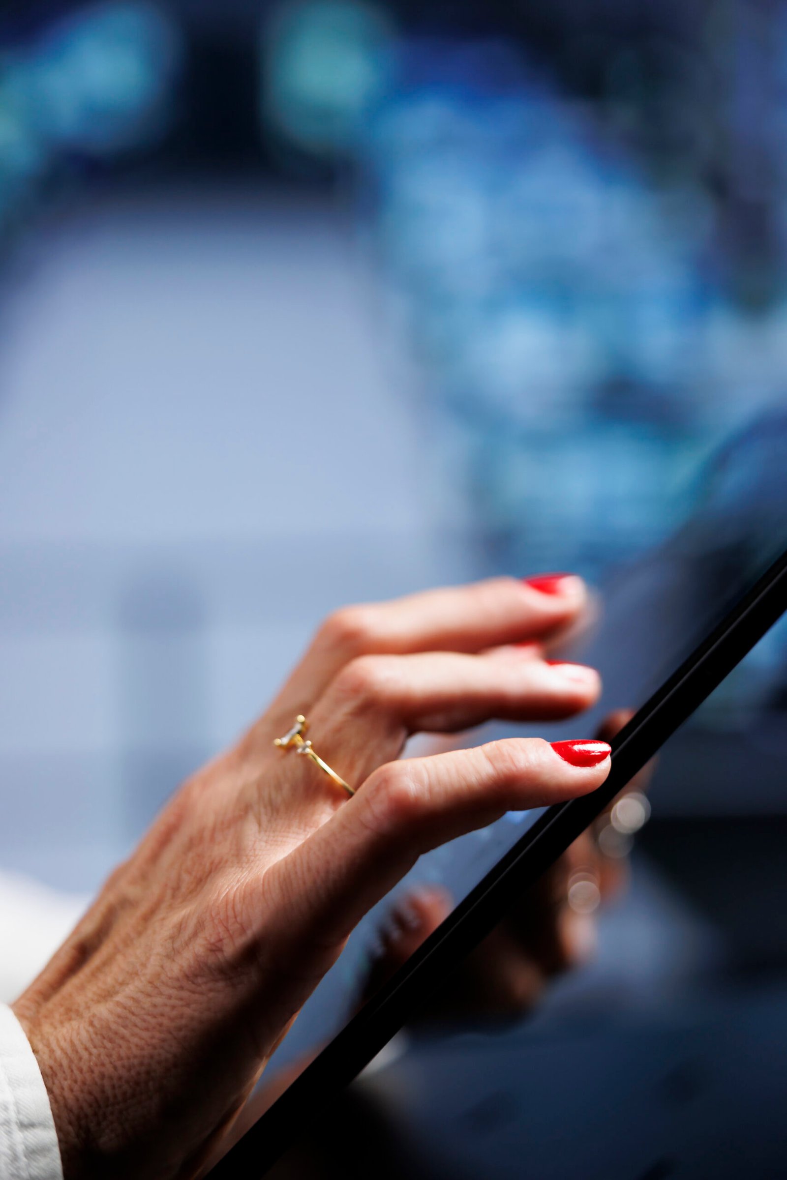IT programmer using tablet to make sure valuable data remains shielded from security drawbacks, safeguarding high tech workplace servers against unauthorized access and vulnerabilities, close up